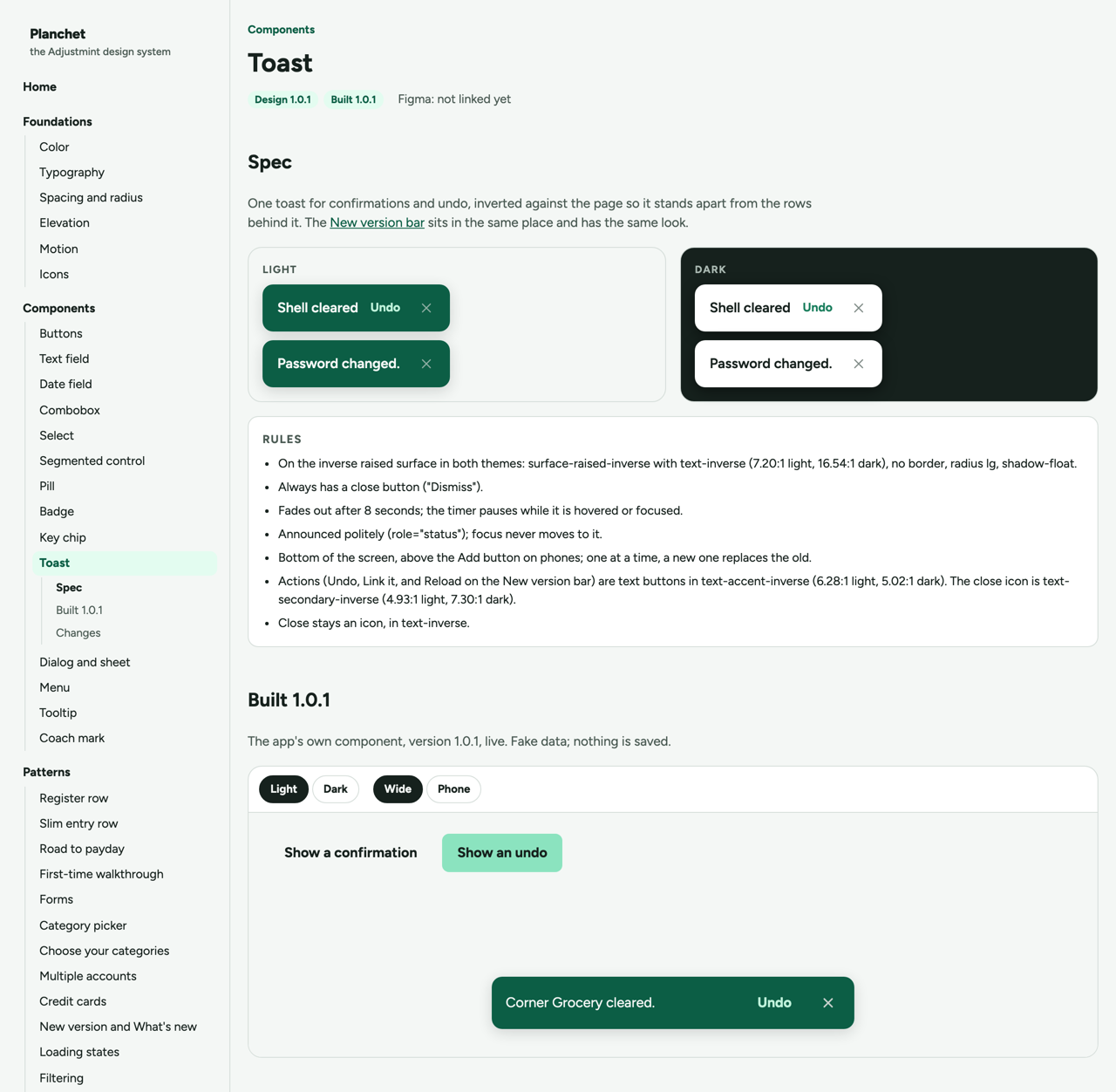 The Toast component page, carrying a Design 1.0.1 badge and a Built 1.0.1 badge. At the top, the same two toasts shown once on a light background and once on a dark one. A rules list follows, giving the surface and text roles with their measured contrast ratios, an eight second fade whose timer pauses while the toast is hovered or focused, and a note that it is announced politely and never takes focus. At the bottom, under a heading reading Built 1.0.1, the live component sits with Light, Dark, Wide and Phone toggles and a toast running that reads Corner Grocery cleared, with an Undo action.